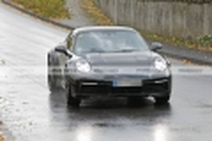 The 2023 Porsche 911 Safari poses in the rain in new spy photos